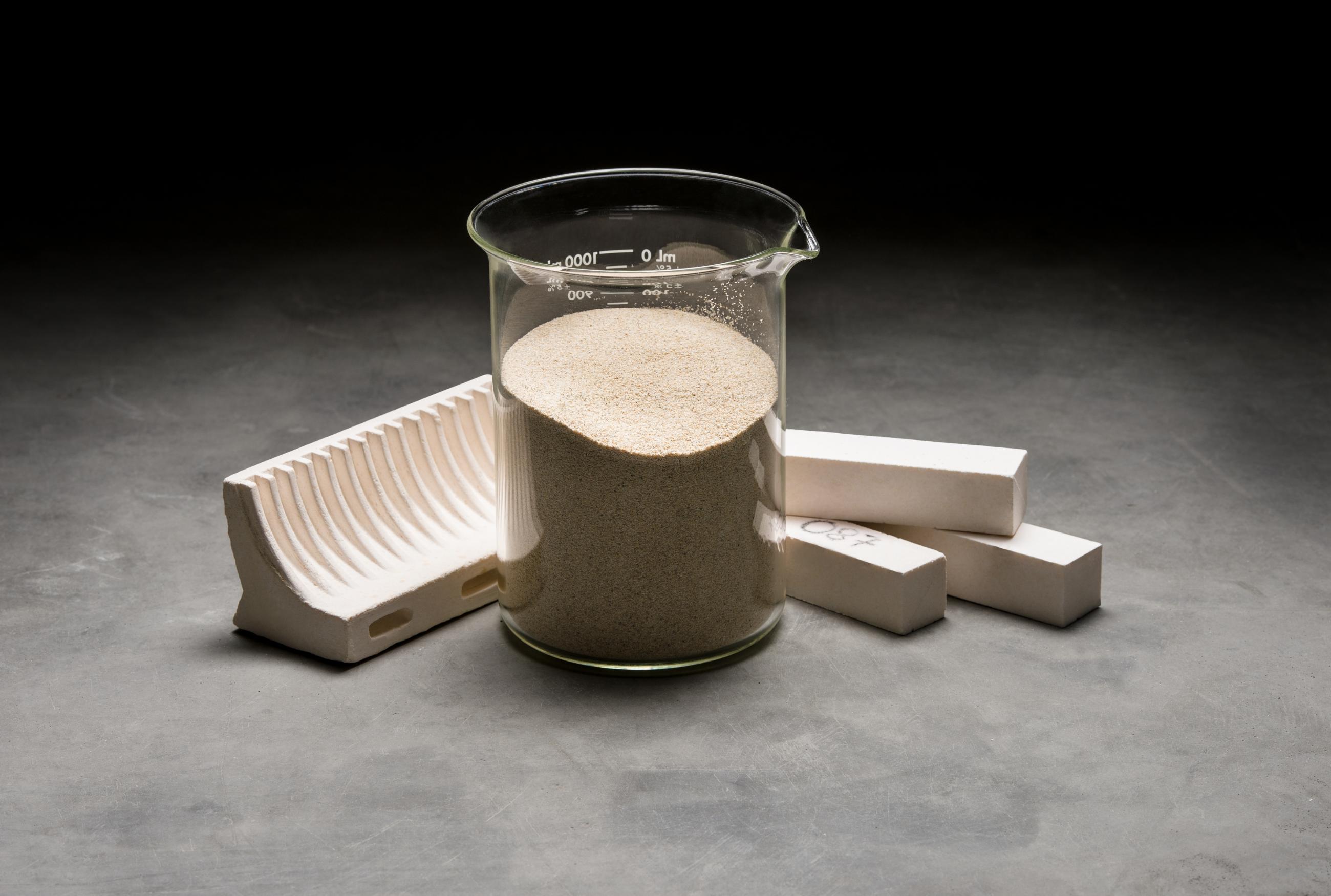 Product photography showcasing the cordierite material in a glass beaker