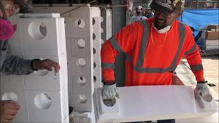 A Blasch employee installing StaBlox bricks.